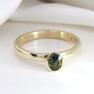 0.62ct Oval Bi-Colour Sapphire Bezel Ring