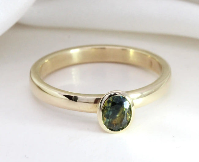 0.62ct Oval Bi-Colour Sapphire Bezel Ring