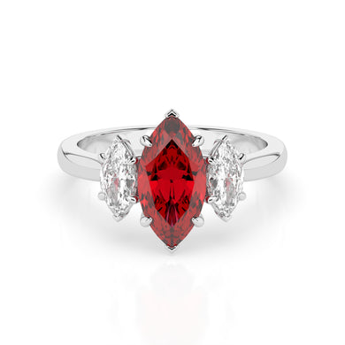 The Ruby Violet ring features a large marquise-cut red gemstone set at its center, elegantly flanked by two smaller marquise-cut clear diamonds on each side. Its secure setting beautifully showcases and protects the stunning gemstones.