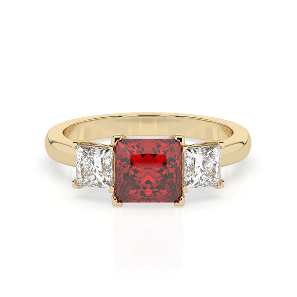 The Ruby Violet ring showcases a large, square-cut red gemstone at its center, flanked on each side by two smaller, square-cut clear gemstones, all set securely to beautifully highlight the stunning central stone.